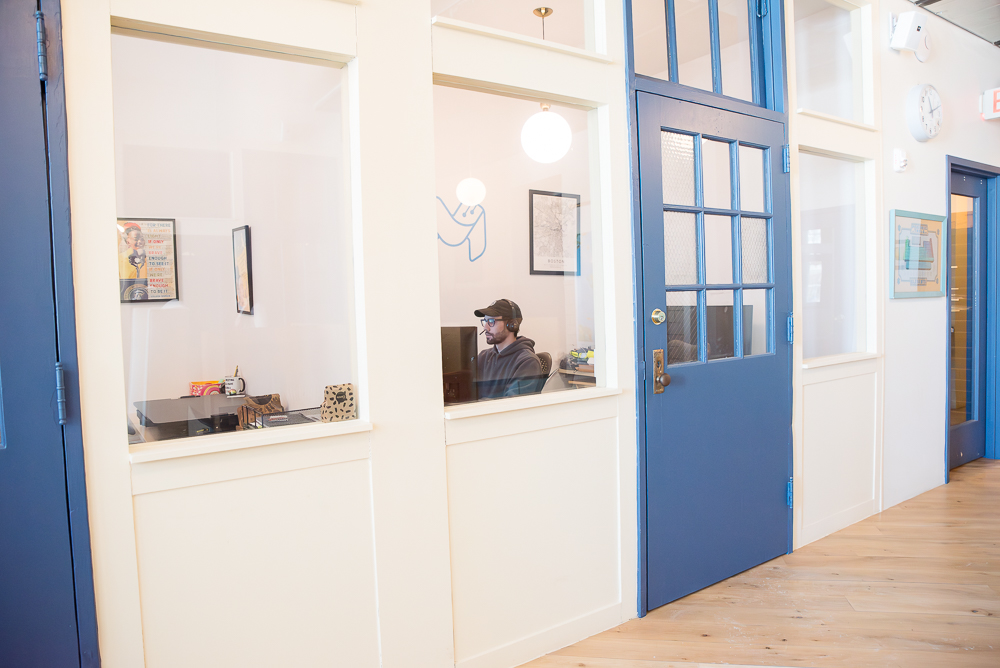Private offices at Fulton Commons Pittsburgh, blue doors and corridor with natural light